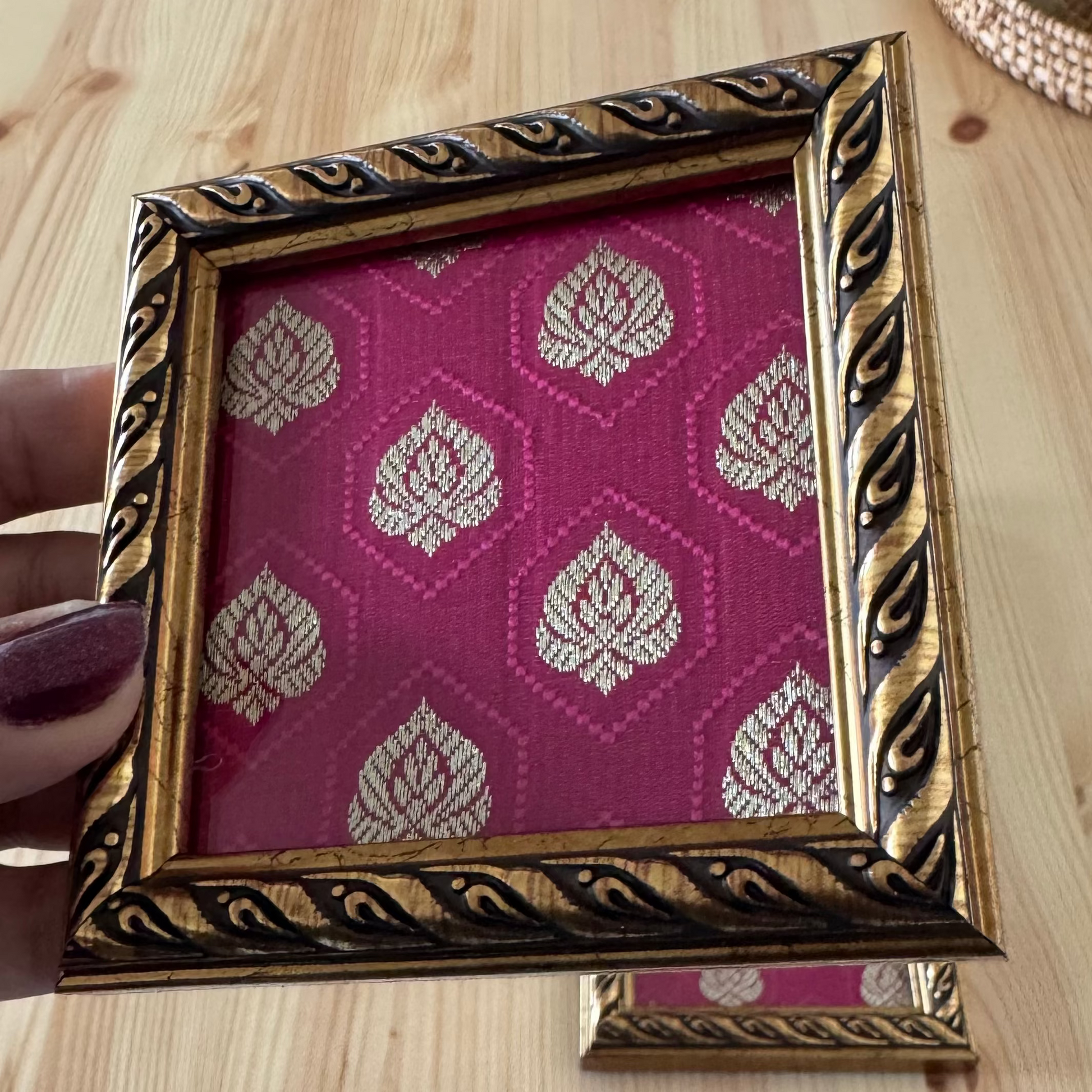 Ornate wooden gold frame with magenta brocade fabric inlay coaster.